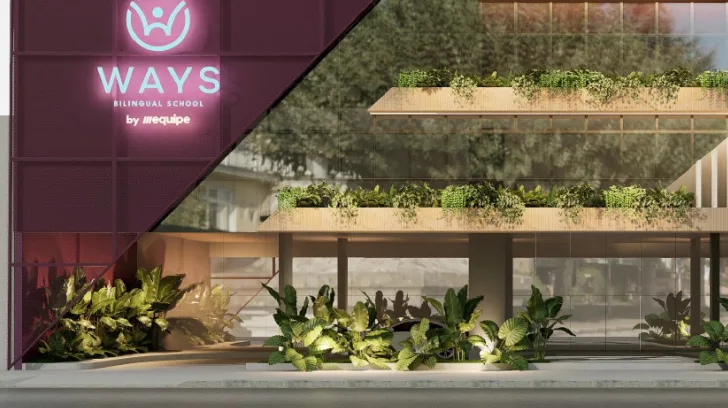 Fachada da Ways Belém by Equipe, com o logo iluminado e floreiras nos andares